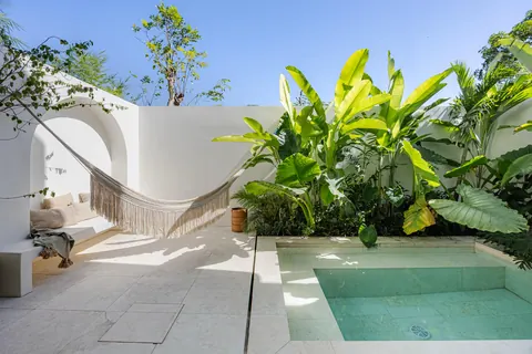 Plunge pool terrace with hammock and tropical plants